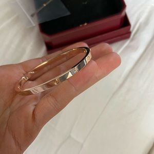Gold Cartier love bracelet